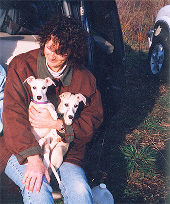 Iva holding puppies